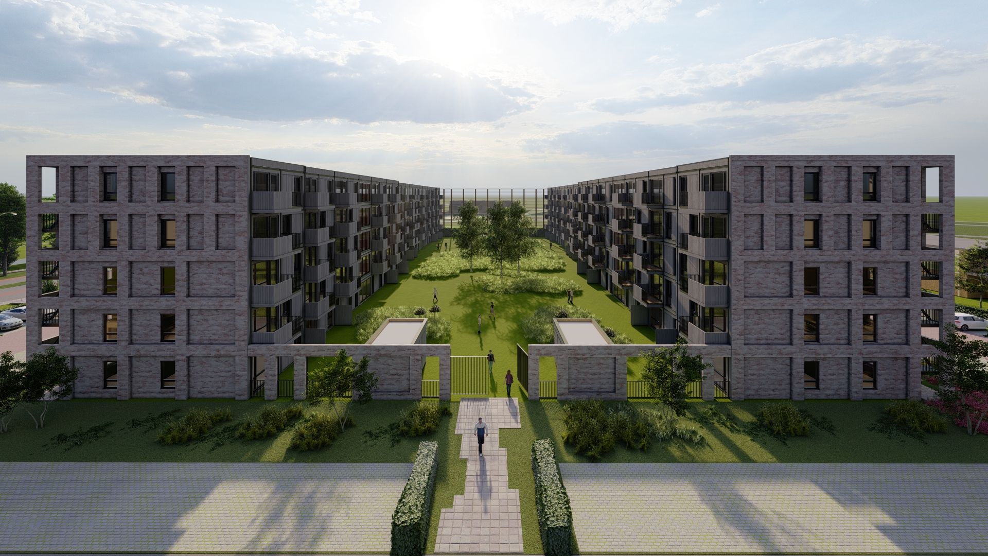Houten gebouwen in een u-vorm met een binnenplaats met gras en bomen