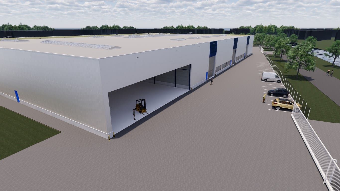 Wit gebouw met heftruck en auto's